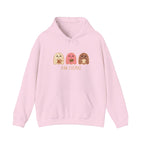 Pink hoodie with cartoon designs and text 'Pan-Tasmas' on a gray background, featuring a brand logo.