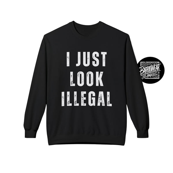 Black sweatshirt with 'I JUST LOOK ILLEGAL' text on a gray background