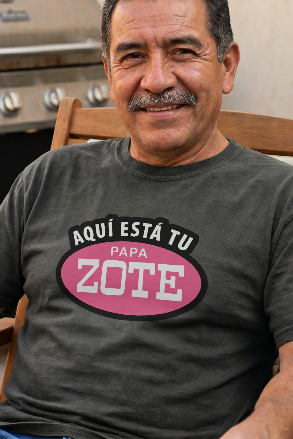 Man sitting outdoors with a beer, wearing a t-shirt with a message.