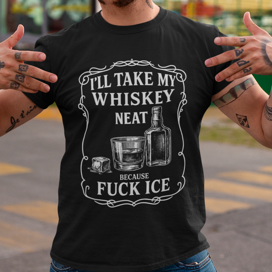 Person wearing a black t-shirt with a graphic and text, standing in an outdoor setting.